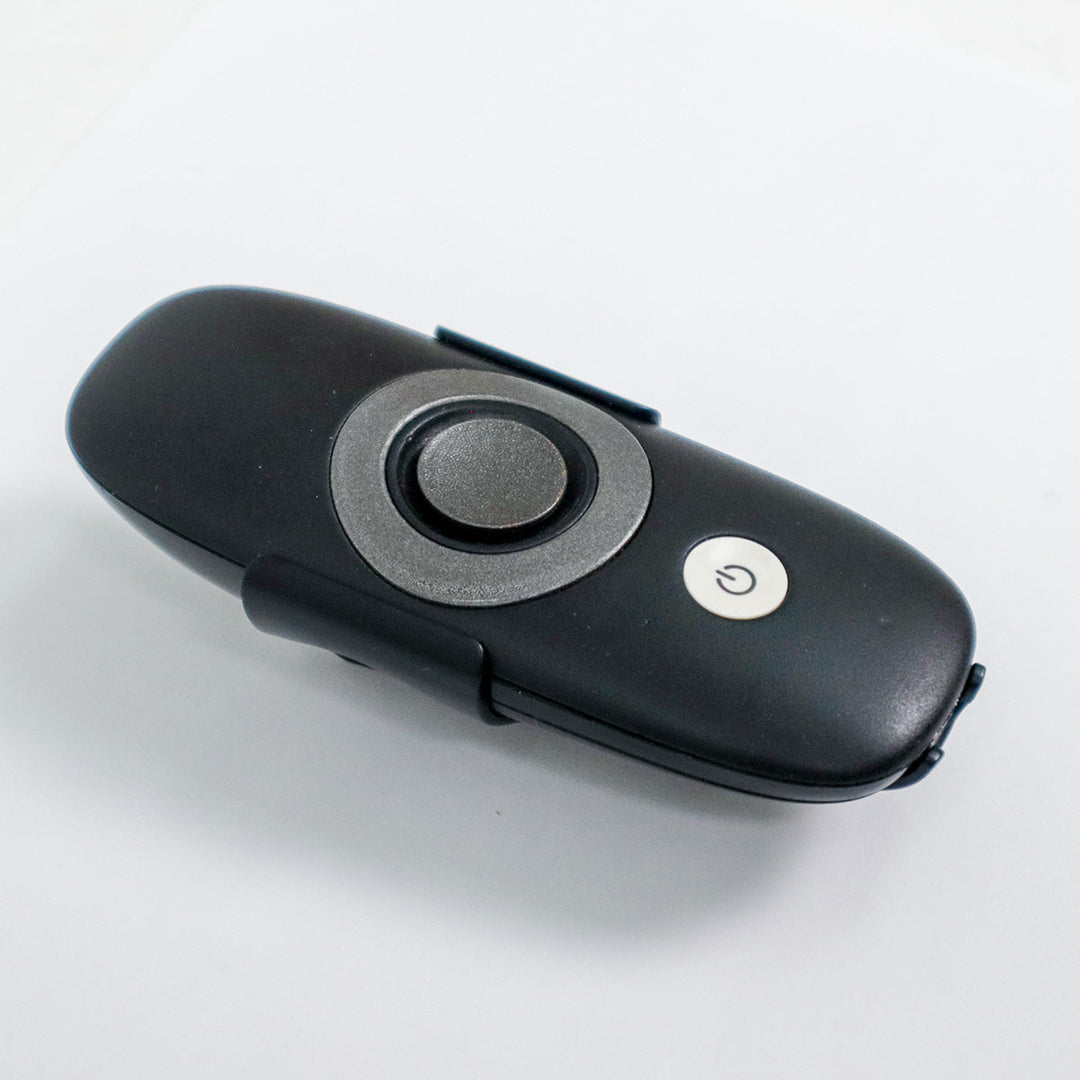 Zero Friction STRIDE remote control for golf trolley with black casing and central circular navigation button