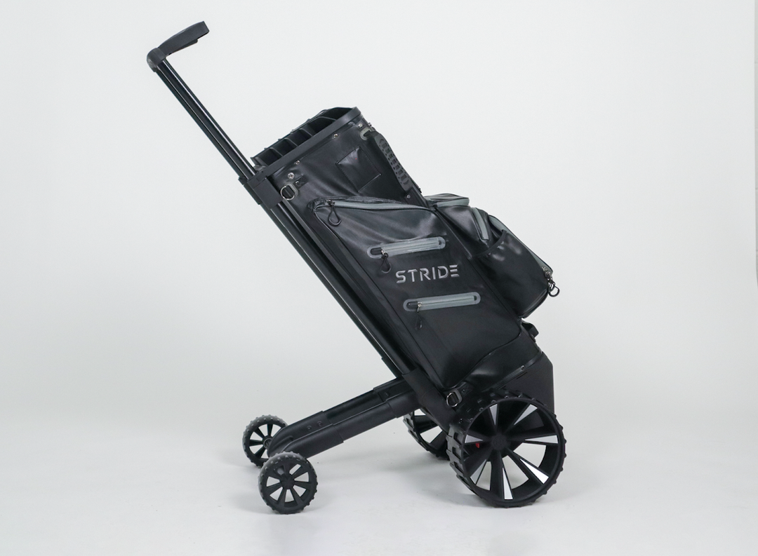 Zero Friction STRIDE remote and follow-me golf bag in black with integrated trolley wheels and aluminum frame.