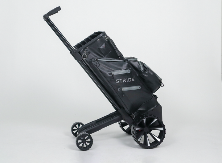 Zero Friction STRIDE remote and follow-me golf bag in black with integrated trolley wheels and aluminum frame.