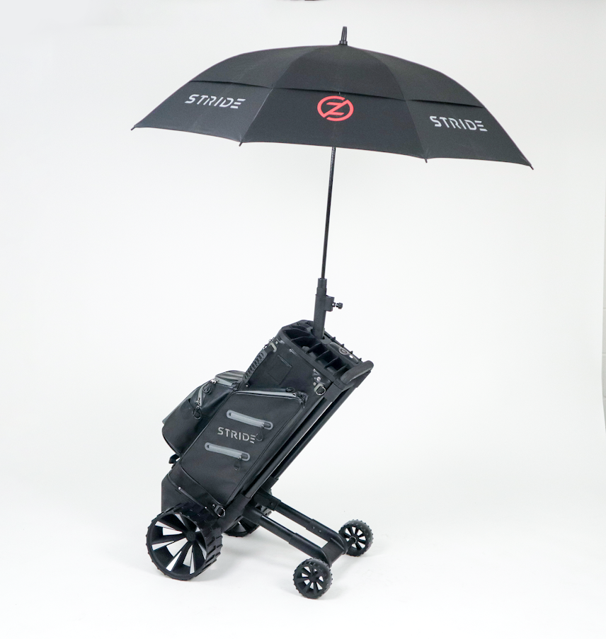Zero Friction STRIDE remote follow-me golf bag and trolley in black with an open branded umbrella on a white background